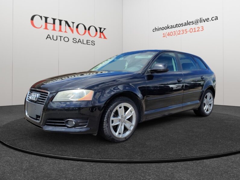 2009 Audi A3 in black, showcasing sporty design and alloy wheels, displayed at Chinook Auto Sales with contact information.