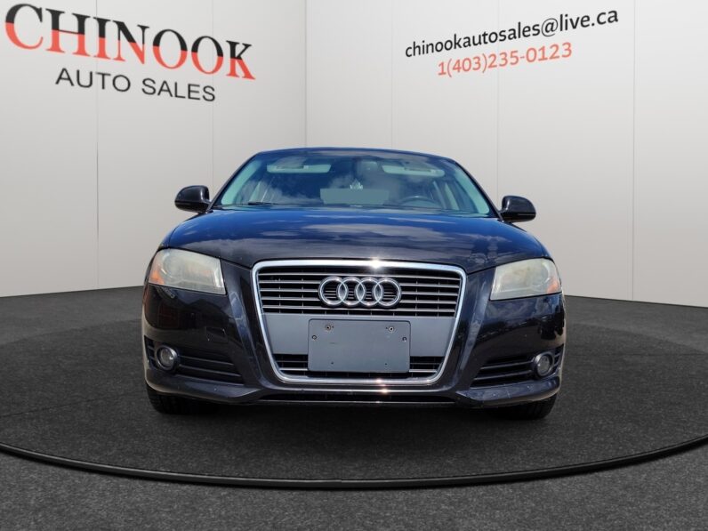 2009 Audi A3 front view at Chinook Auto Sales, showcasing stylish design and luxury features, with dealership branding visible in the background.