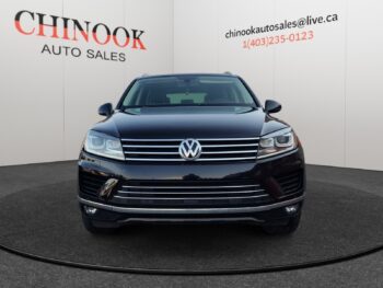 Volkswagen Touareg front view, showcasing sleek design and chrome grille, featured at Chinook Auto Sales, emphasizing used vehicle inventory and special offers.