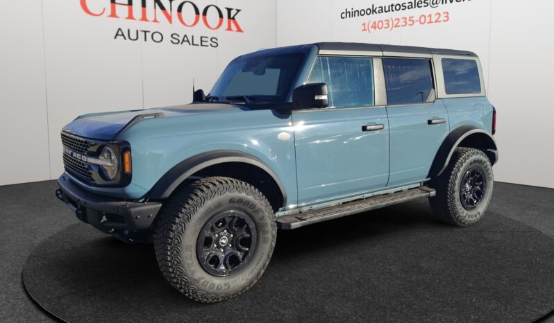 2022 Ford Bronco Wildtrak Sasquatch in blue, showcasing rugged off-road design and features, displayed at Chinook Auto Sales.