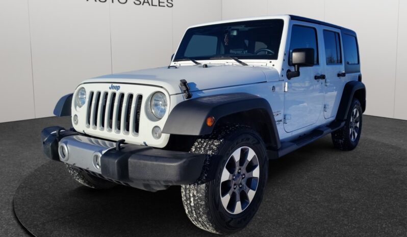 2018 Jeep Wrangler Sahara Unlimited 4&times;4 in white, showcasing front-left view, highlighting rugged design and off-road capabilities, featured at Chinook Auto Sales.
