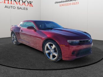 Chevrolet Camaro in red, showcasing a sleek design and sporty features, displayed at Chinook Auto Sales, with emphasis on vehicle details for prospective buyers.