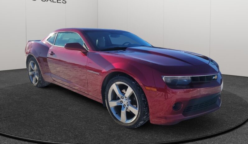 2014 Chevrolet Camaro 2LT in red, showcasing a sleek coupe design with prominent headlights and sporty alloy wheels, positioned on a neutral background.