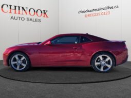 2014 Chevrolet Camaro 2LT in red, side view showcasing sleek coupe design and alloy wheels, featured at Chinook Auto Sales.