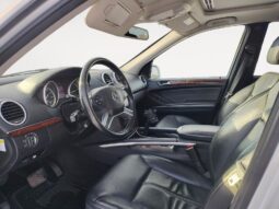 Interior view of 2010 Mercedes-Benz GL350 Diesel showcasing black leather seating, dashboard controls, and steering wheel, emphasizing luxury features available at Chinook Auto Sales.