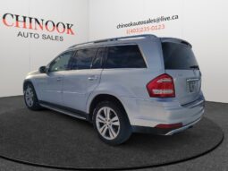 2010 Mercedes-Benz GL350 Diesel in silver, side and rear view, showcasing dealership branding from Chinook Auto Sales.