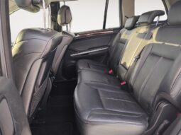 Interior view of the rear seating area in a 2010 Mercedes-Benz GL350 Diesel, featuring leather-appointed seating and spacious layout, emphasizing comfort for passengers.
