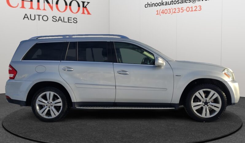 2010 Mercedes-Benz GL350 Diesel in silver, side view, showcased at Chinook Auto Sales with dealership branding in background.