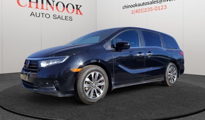 2022 Honda Odyssey EX-L in black, displayed at Chinook Auto Sales, showcasing a sleek exterior design and family-friendly features.