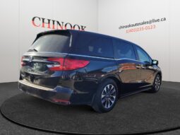 Honda Odyssey in black, showcasing rear and right side, featured at Chinook Auto Sales, Calgary, used car dealership.