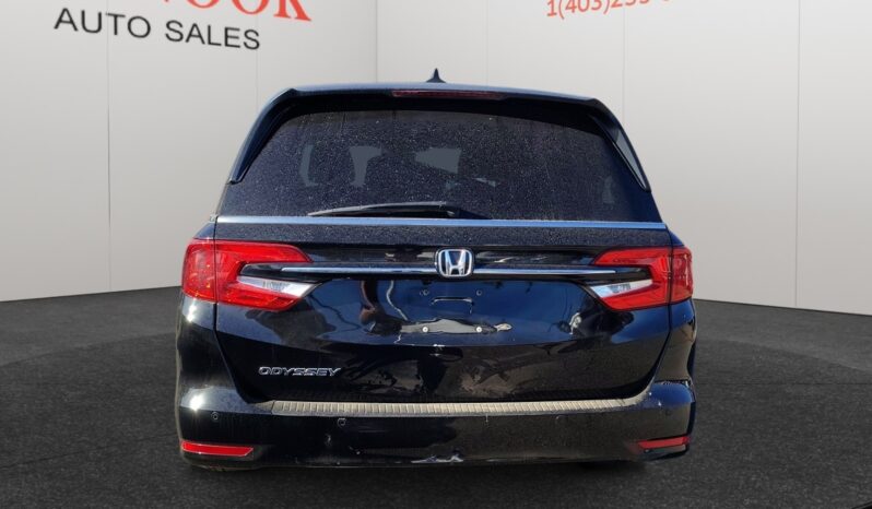 2022 Honda Odyssey EX-L rear view, black exterior, dealership background at Chinook Auto Sales, showcasing family-friendly van features.
