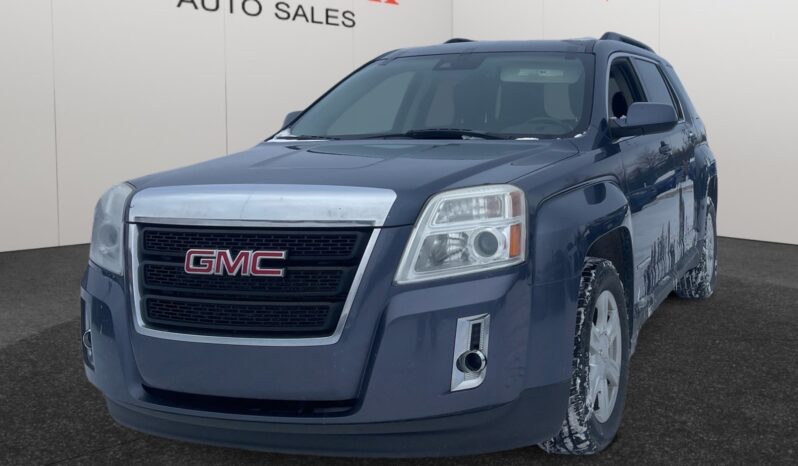2014 GMC Terrain SLT in Deep Blue Pearl at Chinook Auto Sales, showcasing front view with prominent GMC logo and sleek SUV design.
