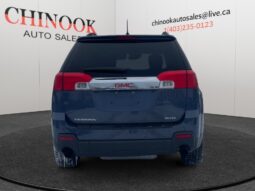 2014 GMC Terrain SLT rear view in Deep Blue Pearl, showcasing the SUV's sleek design and Chinook Auto Sales branding.