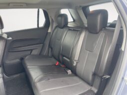 Interior view of the back seat of a 2014 GMC Terrain SLT, showcasing spacious black leather seating and ample legroom, relevant for family SUV buyers.