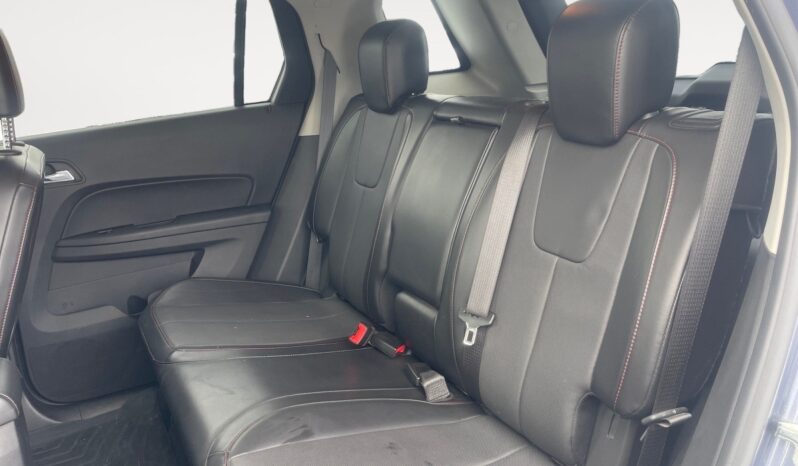 Interior view of the back seat of a 2014 GMC Terrain SLT, featuring black leather upholstery and ample seating space, highlighting family-friendly comfort and style.
