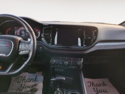 Interior view of a 2023 Dodge Durango GT AWD dashboard featuring a central touchscreen display, instrument cluster, and stylish controls, with floor mats displaying "Thank You."