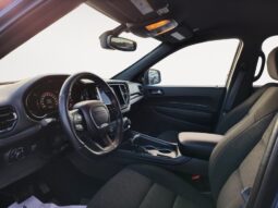Interior view of a 2023 Dodge Durango GT AWD showcasing the driver's seat, steering wheel, dashboard, and modern design elements, emphasizing comfort and advanced features for an SUV.