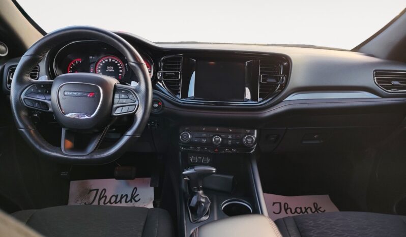Dodge Durango GT AWD interior featuring steering wheel, dashboard display, and center console with controls, highlighting premium design and technology.