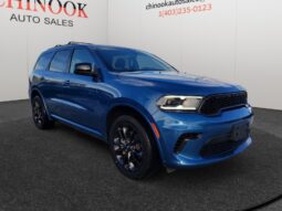 2015 Ford Escape SE in blue, showcasing front-right view, displayed at Chinook Auto Sales, emphasizing used vehicle features and pricing.
