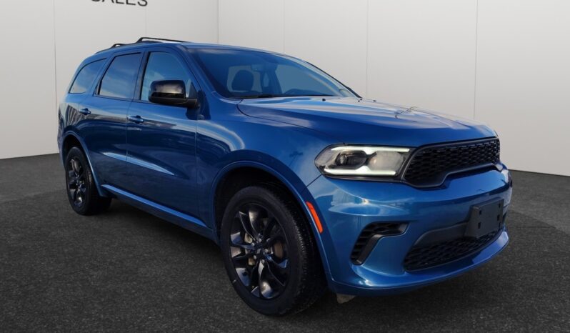 2023 Dodge Durango GT AWD in blue, showcasing a sleek design with bold front grille and sporty wheels, featured at Chinook Auto Sales for CAD $39,998.