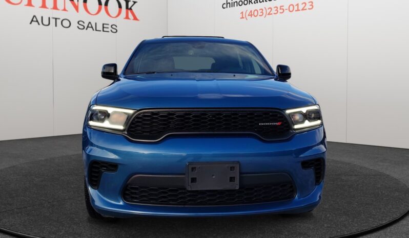 2023 Dodge Durango GT AWD in blue, showcasing front view with distinctive grille and headlights, set against Chinook Auto Sales backdrop.