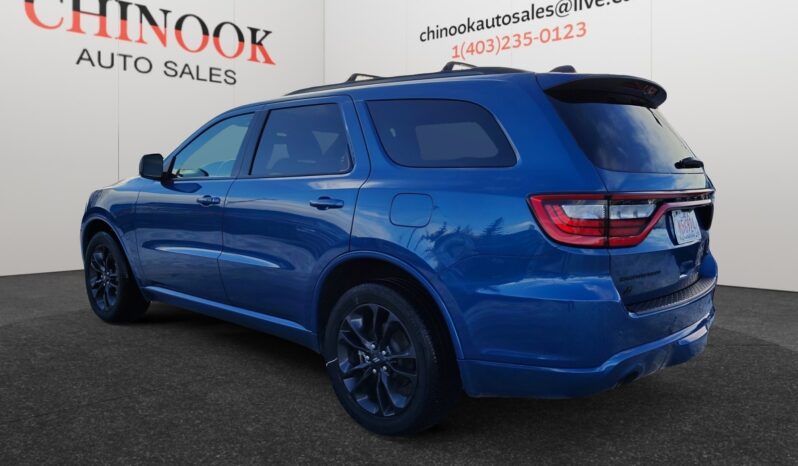 2023 Dodge Durango GT AWD in blue, showcasing rear-left view with sleek design, available at Chinook Auto Sales, emphasizing its SUV body style and modern features.