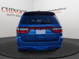 2023 Dodge Durango GT AWD in blue, rear view showcasing sleek design and modern tail lights, set against Chinook Auto Sales branding.