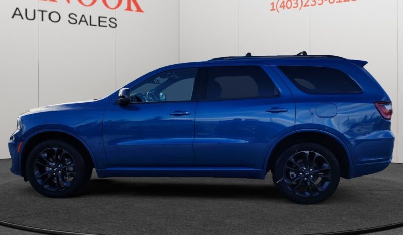 2023 Dodge Durango GT AWD in blue, side view, showcasing sleek design and sporty wheels, featured at Chinook Auto Sales.