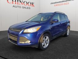 2015 Ford Escape SE in blue, showcasing front-left view, parked at Chinook Auto Sales, highlighting SUV design and dealership branding.