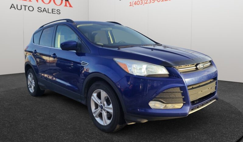 2015 Ford Escape SE in blue, showcasing sleek design and SUV features, available at Chinook Auto Sales, with emphasis on utility and comfort for Calgary drivers.