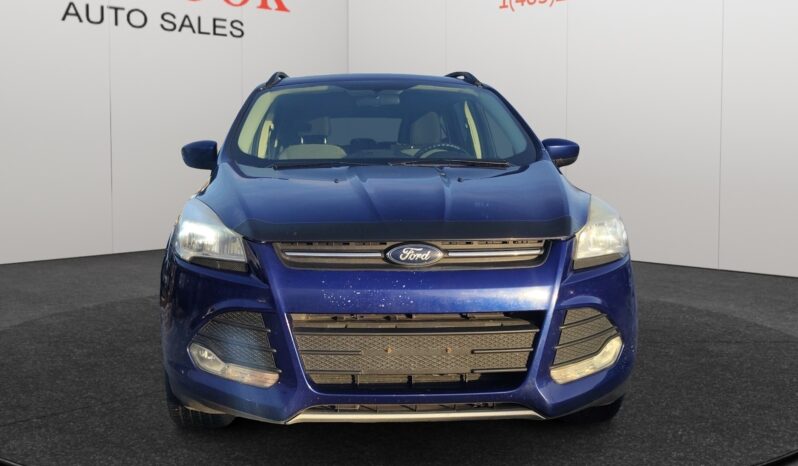 2015 Ford Escape SE in blue, featuring a prominent front view, showcasing the Ford logo and sleek design, set against a neutral backdrop for Chinook Auto Sales vehicle listing.
