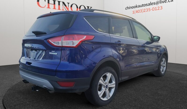 2015 Ford Escape SE in blue, showcasing rear and right side view, highlighting SUV design and features, displayed at Chinook Auto Sales.