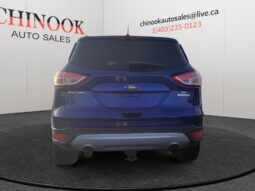 2015 Ford Escape SE rear view in blue, showcasing SUV design, Chinook Auto Sales branding, and vehicle features for potential buyers.