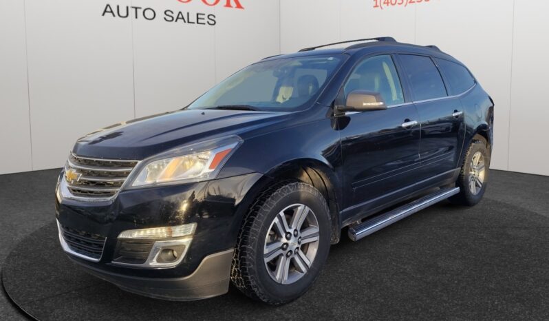2017 Chevrolet Traverse 2LT AWD in black, showcasing a front-left view, featuring all-wheel drive, suitable for Calgary winter conditions, displayed at Chinook Auto Sales.