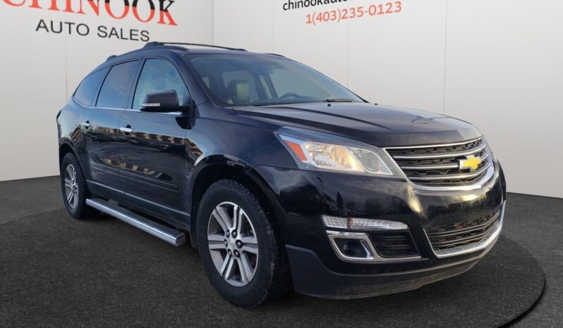 2017 Chevrolet Traverse 2LT AWD in black, showcasing a sleek design with all-wheel drive capability, parked at Chinook Auto Sales, ideal for Calgary families and winter conditions.