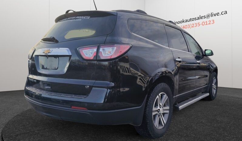 2017 Chevrolet Traverse 2LT AWD in black, showcasing rear and right side view, highlighting SUV design and features, suitable for Calgary families and winter conditions.