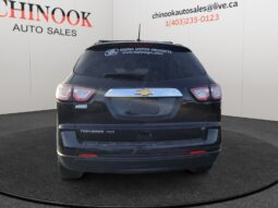 2017 Chevrolet Traverse 2LT AWD rear view, black SUV with Chevrolet logo, featured at Chinook Auto Sales, showcasing used vehicle for Calgary families.