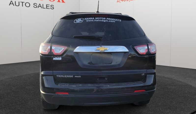 2017 Chevrolet Traverse 2LT AWD, black SUV rear view, showcasing Chevrolet logo and dealership branding, suitable for Calgary families and winter conditions.
