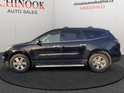 2017 Chevrolet Traverse 2LT AWD side view, black exterior, showcasing SUV design for Calgary families at Chinook Auto Sales.