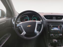 2017 Chevrolet Traverse 2LT AWD interior view showing steering wheel, dashboard controls, and instrument cluster, highlighting features for Calgary families.