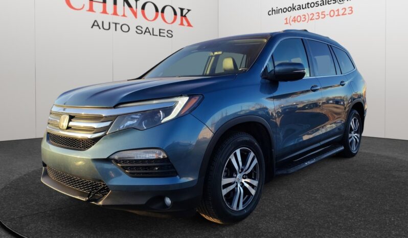 2016 Honda Pilot EXL-R SUV in blue, showcasing a stylish front-left angle, with Chinook Auto Sales branding in the background, emphasizing its family-friendly design and 4WD capability.
