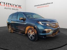 2015 Ford Escape SE SUV in blue, showcasing exterior features and dealership branding from Chinook Auto Sales.
