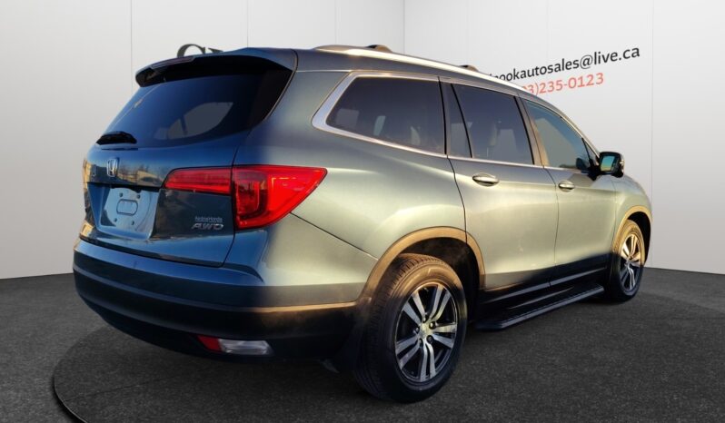 2016 Honda Pilot EXL-R in blue, showcasing rear and right side view, highlighting 4WD capability and sleek design, featured in Chinook Auto Sales listing for CAD $23,998.