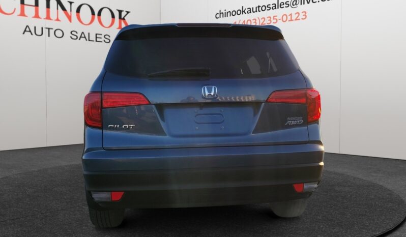 2016 Honda Pilot EXL-R rear view, blue SUV with dealership branding from Chinook Auto Sales, showcasing spacious design suitable for families.
