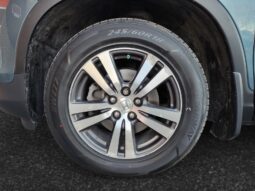 Honda Pilot EXL-R front left wheel with alloy rim and tire, showcasing design and condition relevant to the 2016 SUV listing at Chinook Auto Sales.